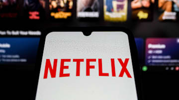 In this photo illustration, the Netflix Logo displayed on a...