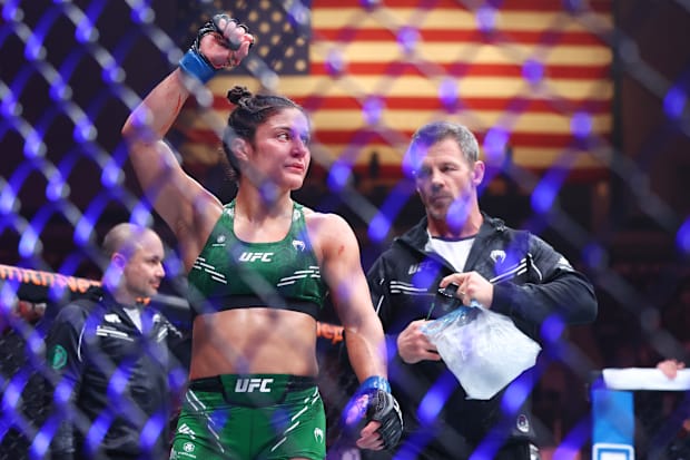 Loopy Godinez (blue gloves) reacts after her fight with Virna Jandiroba (not pictured) during UFC Fight Night.