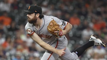 Apr 1, 2025; Houston, Texas, USA; San Francisco Giants relief pitcher Ryan Walker (74) delivers a pitch during the ninth inning against the Houston Astros at Daikin Park. Mandatory Credit: Troy Taormina-Imagn Images