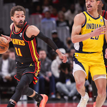 Mar 6, 2025; Atlanta, Georgia, USA; Atlanta Hawks guard Trae Young (11) handles the ball against the Indiana Pacers in the second quarter at State Farm Arena. Mandatory Credit: Brett Davis-Imagn Images