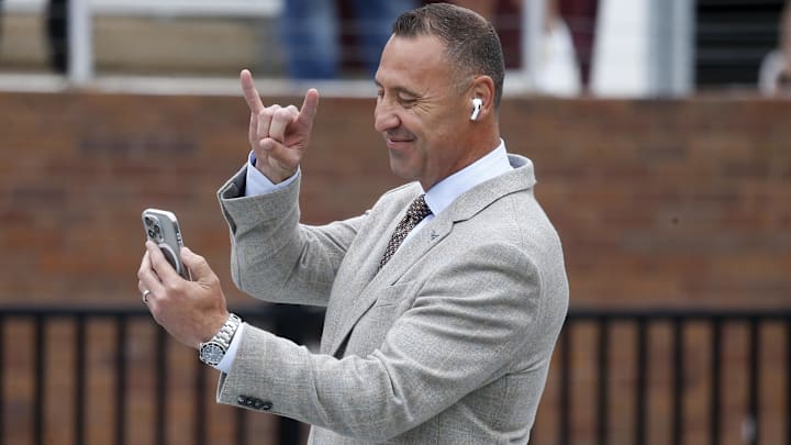Oct 25, 2025; Starkville, Mississippi, USA; Texas Longhorns head coach Steve Sarkisian does the “horns up” sign prior to the game against the Mississippi State Bulldogs at Davis Wade Stadium at Scott Field. Mandatory Credit: Petre Thomas-Imagn Images