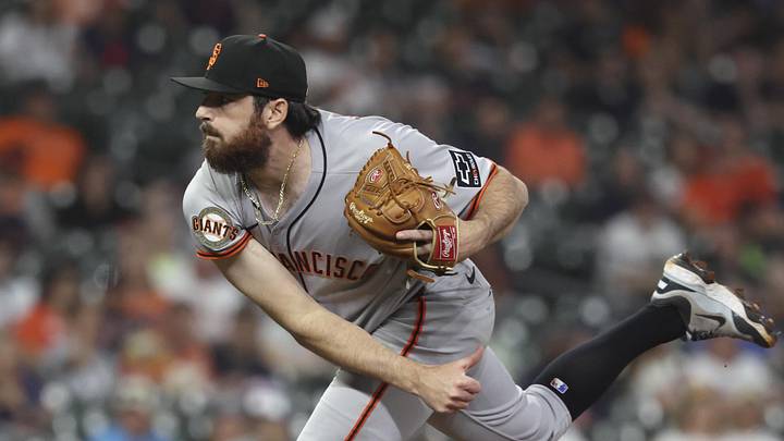 Apr 1, 2025; Houston, Texas, USA; San Francisco Giants relief pitcher Ryan Walker (74) delivers a pitch during the ninth inning against the Houston Astros at Daikin Park. Mandatory Credit: Troy Taormina-Imagn Images