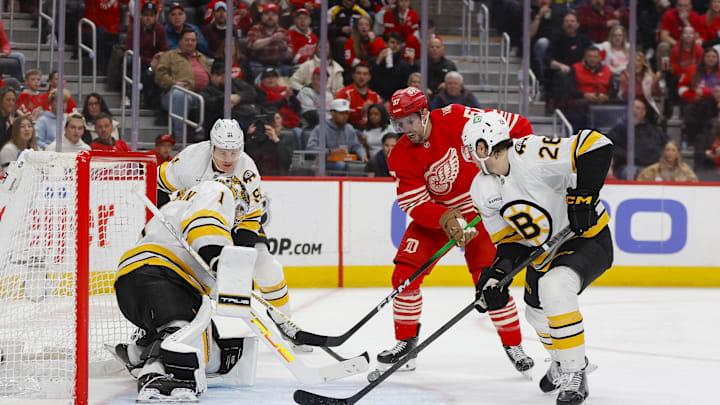 Mar 21, 2026; Detroit, Michigan, USA; Detroit Red Wings left wing David Perron (57) takes a shot on Boston Bruins goaltender Jeremy Swayman (1) during the second period at Little Caesars Arena. Mandatory Credit: Brian Bradshaw Sevald-Imagn Images