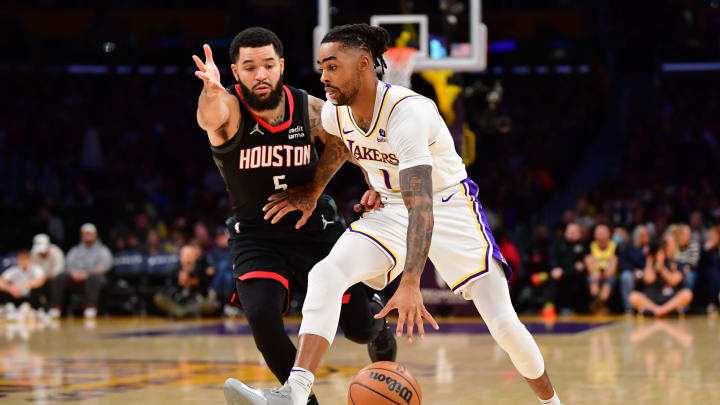 Dec 2, 2023; Los Angeles, California, USA; Los Angeles Lakers guard D   Angelo Russell (1) moves the ball against Houston Rockets guard Fred VanVleet (5) during the first half at Crypto.com Arena. Mandatory Credit: Gary A. Vasquez-USA TODAY Sports