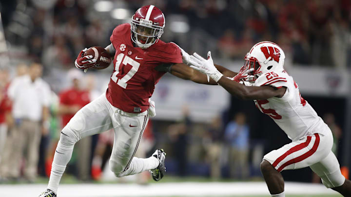 Sep 5, 2015; Arlington, TX, USA; Alabama Crimson Tide running back Kenyan Drake (17) runs in a touchdown against Wisconsin Badgers cornerback Derrick Tindal (25) during the fourth quarter at AT&T Stadium. 