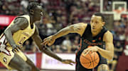 Mar 9, 2024; Tallahassee, Florida, USA; Miami Hurricanes guard Matthew Cleveland (right) drives to the basket against Florida State Seminoles forward Taylor Bol Bowen (10) during the second half at Donald L. Tucker Center. Mandatory Credit: Melina Myers-Imagn Images