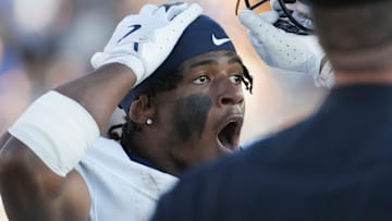 UConn's Skyler Bell reacts to a penalty against the Huskies as the Blue Hens drive for the tying score late in the fourth quarter of Delaware's 44-41 overtime win at Delaware Stadium, Sept. 13, 2025.