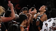 Aug 21, 2025; Las Vegas, Nevada, USA; Las Vegas Aces center A'ja Wilson (22) and teammates celebrate defeating the Phoenix Mercury at Michelob Ultra Arena. 