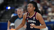 Apr 4, 2025; Tampa, FL, USA;  Connecticut Huskies guard KK Arnold (2) dribbles against the UCLA Bruins during the second quarter in a semifinal of the women's 2025 NCAA tournament at Amalie Arena. Mandatory Credit: Kirby Lee-Imagn Images