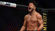 May 9, 2020; Jacksonville, Florida, USA; Henry Cejudo (red gloves) celebrates after defeating Dominick Cruz (blue gloves) during UFC 249 at VyStar Veterans Memorial Arena. Mandatory Credit: Jasen Vinlove-Imagn Images