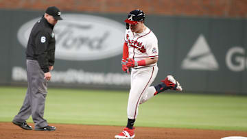 Oct 17, 2021; Cumberland, Georgia, USA; Atlanta Braves right fielder Joc Pederson (22) hits a two run homerun during the fourth inning against the Los Angeles Dodgers in game two of the 2021 NLCS at Truist Park.  Mandatory Credit: Brett Davis-Imagn Images