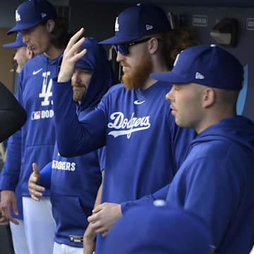 Jun 19, 2025; Los Angeles, California, USA;   Los Angeles Dodgers designated hitter Shohei Ohtani (17) greets starting pitcher Dustin May (85) in the dugout prior to the game against the San Diego Padres at Dodger Stadium. Mandatory Credit: Jayne Kamin-Oncea-Imagn Images