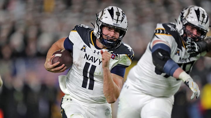 Dec 14, 2024; Landover, Maryland, USA; Navy Midshipmen quarterback Blake Horvath (11) carries the ball against the Army Black Knights during the second half of the the 125th Army-Navy game at Northwest Stadium. Dec 14, 2024; Landover, Maryland, USA; Navy Midshipmen quarterback Blake Horvath (11) carries the ball against the Army Black Knights during the second half of the the 125th Army-Navy game at Northwest Stadium.