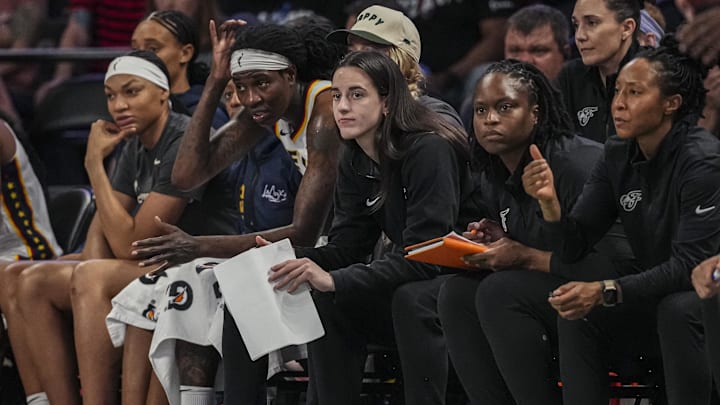 Indiana Fever guard Caitlin Clark follows the action from the bench against the Atlanta Dream. Indiana Fever guard Caitlin Clark follows the action from the bench against the Atlanta Dream.