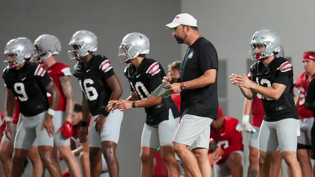 Ohio State Buckeyes head coach Ryan Day watches his quarterbacks throw during football training camp inside the Woody Hayes Athletic Center in Columbus on Aug. 7, 2026. Ohio State Buckeyes head coach Ryan Day watches his quarterbacks throw during football training camp inside the Woody Hayes Athletic Center in Columbus on Aug. 7, 2026.