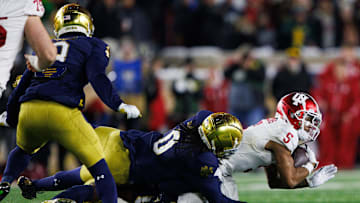 Indiana wide receiver Ke'Shawn Williams (5) is brought down by Notre Dame during the first round of the College Football Playoff between Notre Dame and Indiana on Friday, Dec. 20, 2024, in South Bend.