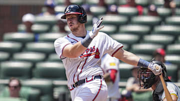 Jun 30, 2024; Cumberland, Georgia, USA; Atlanta Braves catcher Sean Murphy (12) hits a double against the Pittsburgh Pirates during the ninth inning at Truist Park.