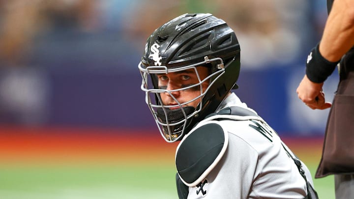 Jun 4, 2022; St. Petersburg, Florida, USA;  Chicago White Sox catcher Reese McGuire (21) looks on in the fifth inning during a game against the Tampa Bay Rays at Tropicana Field. Mandatory Credit: Nathan Ray Seebeck-Imagn Images