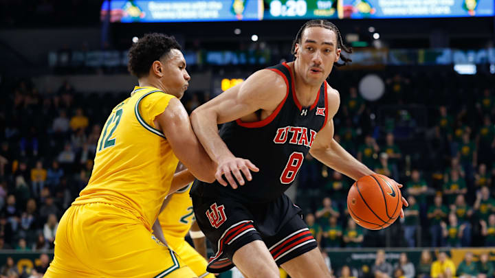 Mar 7, 2026; Waco, Texas, USA;  Utah Utes forward Keanu Dawes (8) controls the ball as Baylor Bears guard Michael Rataj (12) defends during the first half at Paul and Alejandra Foster Pavilion. Mandatory Credit: Chris Jones-Imagn Images