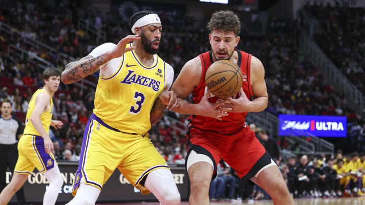 Jan 29, 2024; Houston, Texas, USA; Houston Rockets center Alperen Sengun (28) attempts to keep control of the ball as Los Angeles Lakers forward Anthony Davis (3) defends during the first quarter at Toyota Center. Mandatory Credit: Troy Taormina-USA TODAY Sports