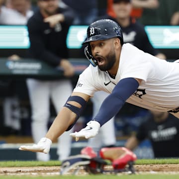 May 12, 2025; Detroit, Michigan, USA;  Detroit Tigers outfielder Riley Greene (31) dives in safe at home third inning against the Boston Red Sox at Comerica Park.