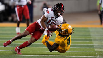 Oct 7, 2023; Waco, Texas, USA; Texas Tech Red Raiders defensive back Bralyn Lux (12) breaks up a pass intended for Baylor Bears wide receiver Ketron Jackson Jr. (11) during the first half at McLane Stadium. Mandatory Credit: Chris Jones-USA TODAY Sports