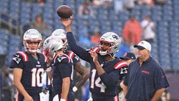 August 8, 2024; Foxborough, MA, USA;  New England Patriots quarterback Jacoby Brissett (14) warms up before a game against the Carolina Panthers at Gillette Stadium.