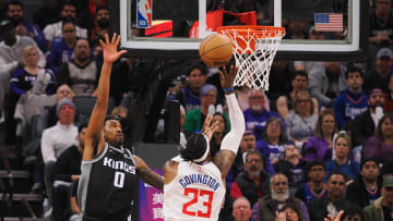 Mar 3, 2023; Sacramento, California, USA; Los Angeles Clippers power forward Robert Covington (23) scores a layup against Sacramento Kings shooting guard Malik Monk (0) during the second quarter at Golden 1 Center. Mandatory Credit: Kelley L Cox-USA TODAY Sports