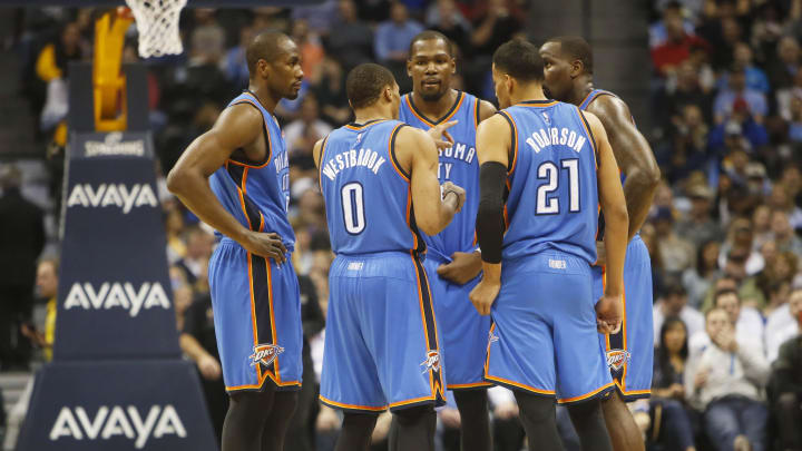 Feb 9, 2015; Denver, CO, USA; Oklahoma City Thunder guard Russell Westbrook (0), forward Kevin Durant (35), guard Andre Roberson (21), and forward Serge Ibaka (far right) huddle during the second half against the Denver Nuggets at Pepsi Center. 