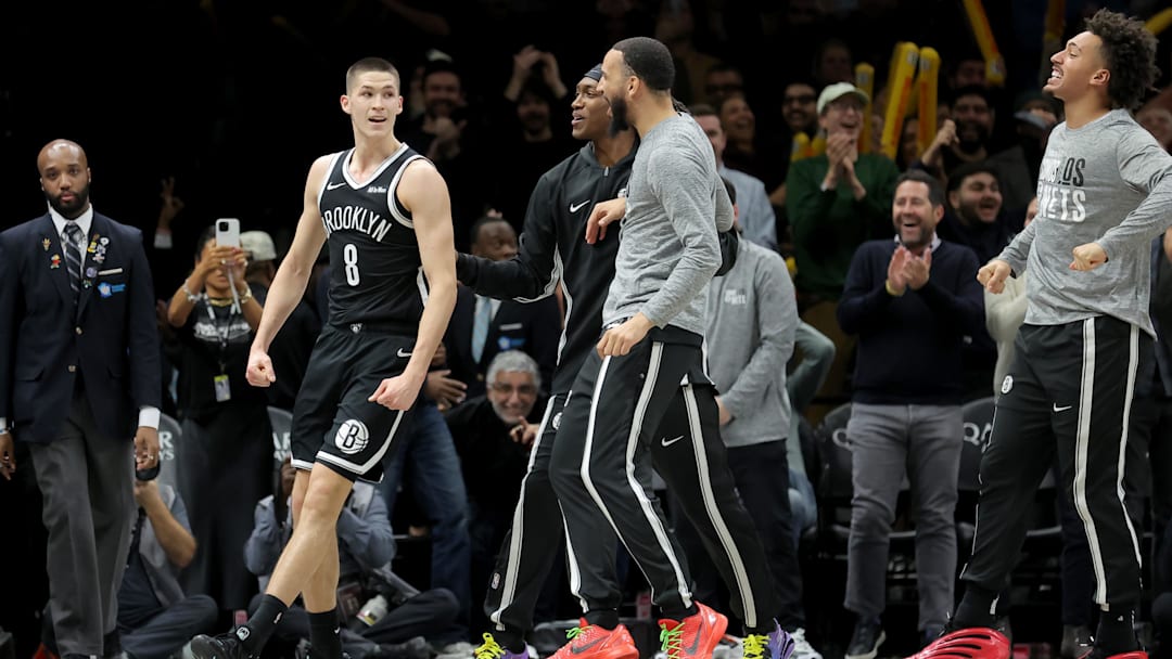 Jan 7, 2026; Brooklyn, New York, USA; Brooklyn Nets guard Egor Demin (8) celebrates his three point shot against the Orlando Magic with teammates during overtime at Barclays Center. Mandatory Credit: Brad Penner-Imagn Images