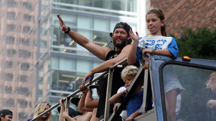 Nov 3, 2025; Los Angeles, CA, USA; Los Angeles Dodgers pitcher Clayton Kershaw acknowledges the crowd during the World Series championship parade at downtown Los Angeles. Mandatory Credit: Kiyoshi Mio-Imagn Images