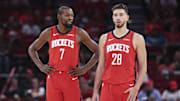Oct 24, 2025; Houston, Texas, USA; Houston Rockets forward Kevin Durant (7) talks with center Alperen Sengun (28) during the first quarter against the Detroit Pistons at Toyota Center. Mandatory Credit: Troy Taormina-Imagn Images