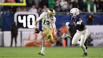 Penn State defensive end Abdul Carter pursues Notre Dame quarterback Riley Leonard during the 2025 Orange Bowl at Hard Rock Stadium.
