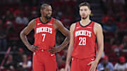 Oct 24, 2025; Houston, Texas, USA; Houston Rockets forward Kevin Durant (7) talks with center Alperen Sengun (28) during the first quarter against the Detroit Pistons at Toyota Center. Mandatory Credit: Troy Taormina-Imagn Images