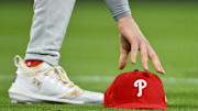 Apr 11, 2025; St. Louis, Missouri, USA;  Philadelphia Phillies third baseman Alec Bohm (28) picks up his hat after chasing down a fly ball against the St. Louis Cardinals during the third inning at Busch Stadium. Mandatory Credit: Jeff Curry-Imagn Images