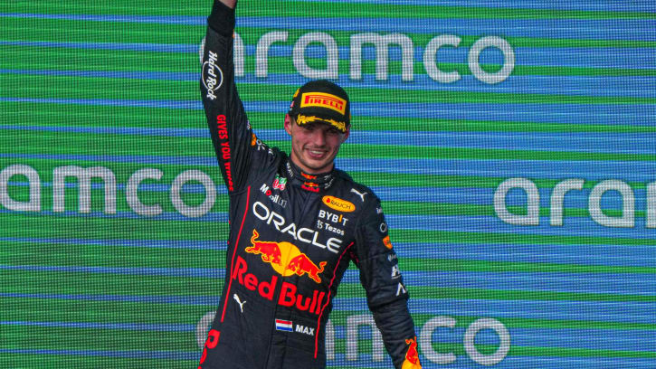 Oracle Red Bull Racing F1 driver Max Verstappen raises the first place trophy after winning the