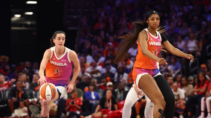 Jul 20, 2024; Phoenix, AZ, USA; Team WNBA guard Caitlin Clark and Angel Reese against the USA Women's National Team during the 2024 WNBA All Star Game at Footprint Center. 