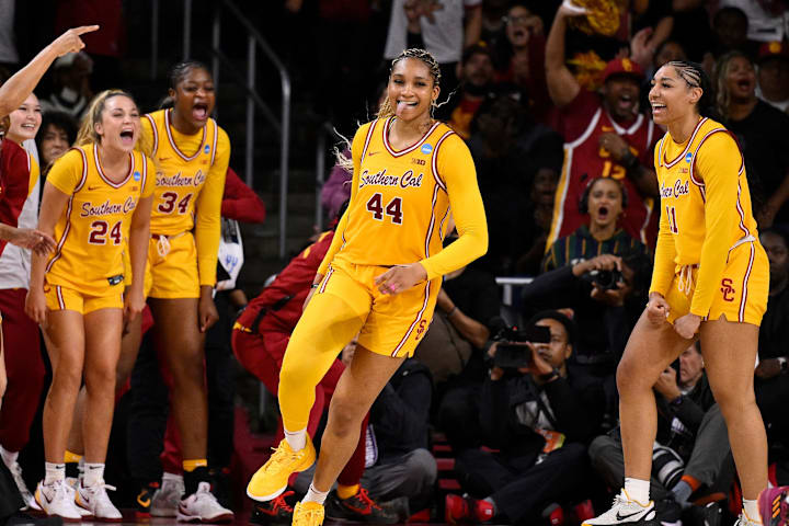 USC Trojans forward Kiki Iriafen celebrates scoring in the third quarter against the Mississippi State Bulldogs.