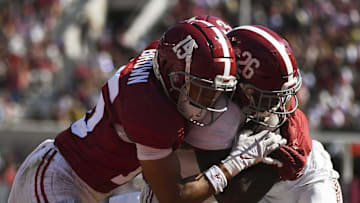 Apr 13, 2024; Tuscaloosa, AL, USA;  Alabama defensive back Zabien Brown (15) hits Alabama running back Jam Miller (26) as Miller scores a touchdown during the A-Day scrimmage at Bryant-Denny Stadium. Mandatory Credit: Gary Cosby Jr.-USA TODAY Sports