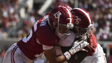 Apr 13, 2024; Tuscaloosa, AL, USA;  Alabama defensive back Zabien Brown (15) hits Alabama running back Jam Miller (26) as Miller scores a touchdown during the A-Day scrimmage at Bryant-Denny Stadium. Mandatory Credit: Gary Cosby Jr.-USA TODAY Sports