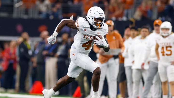 Dec 2, 2023; Arlington, TX, USA; Texas Longhorns running back CJ Baxter (4) runs with the ball during the second quarter against the Oklahoma State Cowboys at AT&T Stadium. Mandatory Credit: Andrew Dieb-USA TODAY Sports