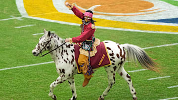 Dec 30, 2023; Miami Gardens, FL, USA; Florida State Seminoles mascot Chief Osceola and Renegade take the field before the game in the 2023 Orange Bowl against the Georgia Bulldogs at Hard Rock Stadium. Mandatory Credit: Jasen Vinlove-Imagn Images