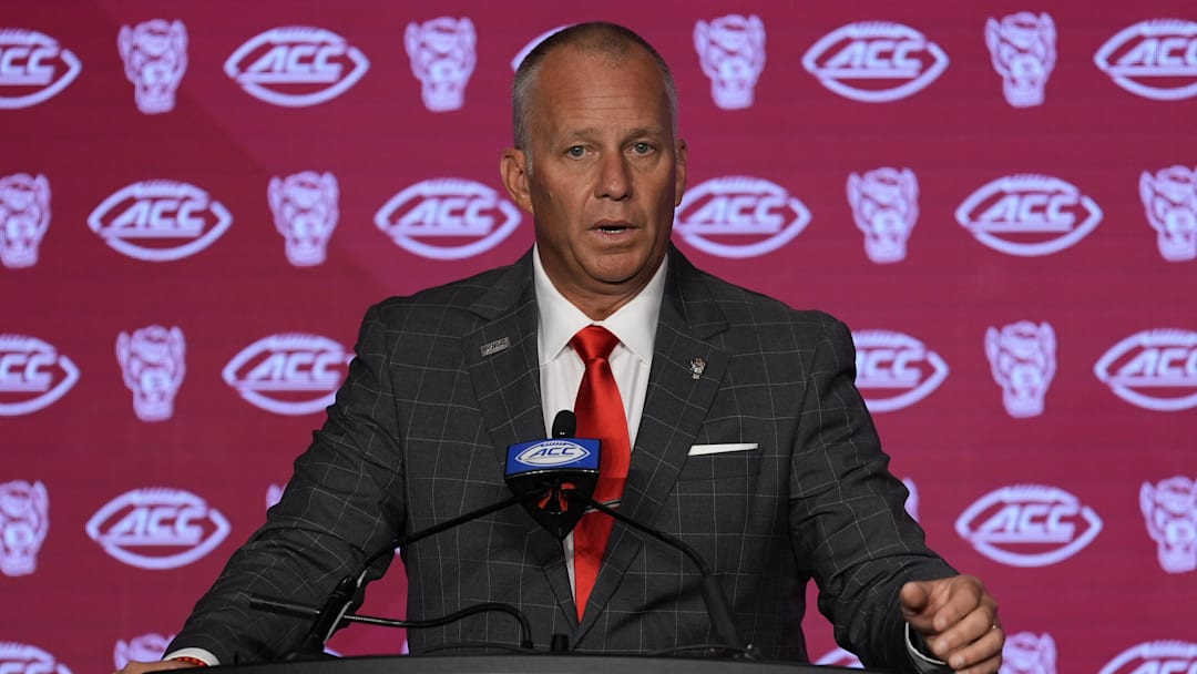 Jul 25, 2024; Charlotte, NC, USA;  North Carolina State Wolfpack head coach Dave Doeren speaks to the media during the ACC Kickoff at Hilton Charlotte Uptown. Mandatory Credit: Jim Dedmon-Imagn Images