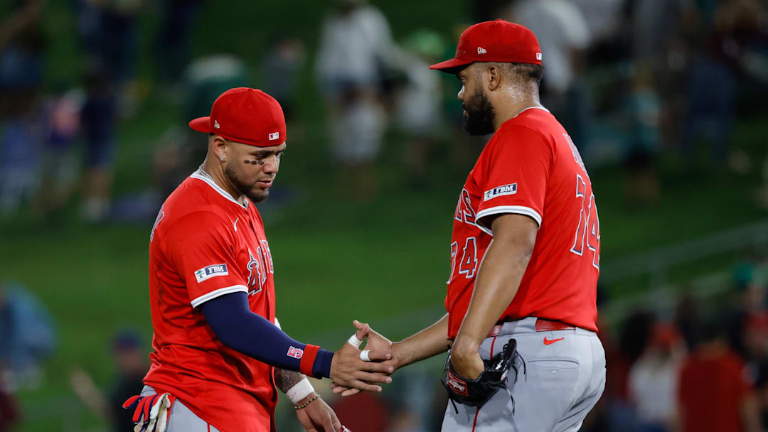 Angels third baseman Yoán Moncada (5) shakes hands with pitcher Kenley Jansen (74) after the game against the Athletics at Sutter Health Park on May 20.