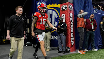 Georgia quarterback Carson Beck (15) takes the field to warm up before the start of the SEC championship game against Texas in Atlanta, on Saturday, Dec. 7, 2024.