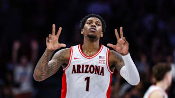 Feb 26, 2025; Tucson, Arizona, USA; Arizona Wildcats guard Caleb Love (1) holds up threes after he shot a three point basket during the first half against the Utah Utes at McKale Center. Mandatory Credit: Aryanna Frank-Imagn Images
