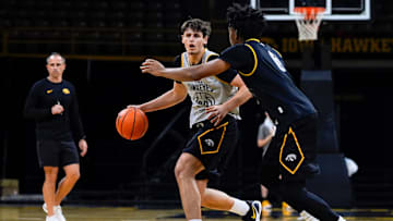 Iowa’s Trey Thompson (20) dribbles the ball as Tavion Banks (6) defends during practice Oct. 15, 2025 at Carver-Hawkeye Arena in Iowa City, Iowa.