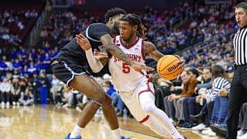 Jan 18, 2025; Newark, New Jersey, USA; St. John's basketball guard Deivon Smith (5) dribbles against Seton Hall Pirates guard Jahseem Felton (15) during the first half at Prudential Center.