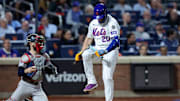 Pete Alonso breaks a bat over his leg after striking out.