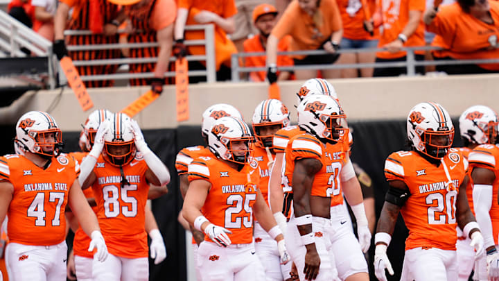 Oklahoma State walks onto the field before the college football game between the Oklahoma State Cowboys and South Dakota State Jackrabbits at Boone Pickens Stadium in Stillwater, Okla., Saturday, Aug., 31, 2024.